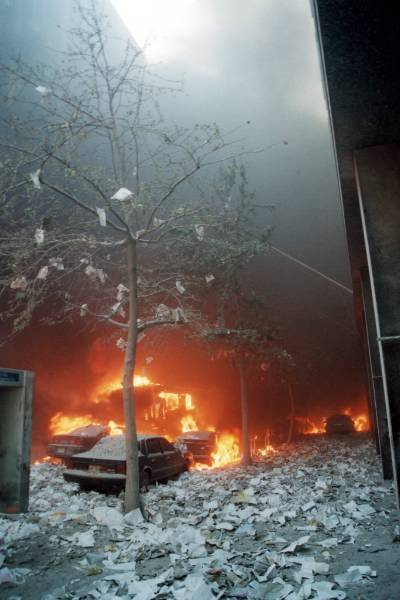 Figure 14. (9/11/01) Vehicle at ground level showing selective thermal damage leaving paper documents unburned, and trees with leaves, demonstrating selective impedance heating